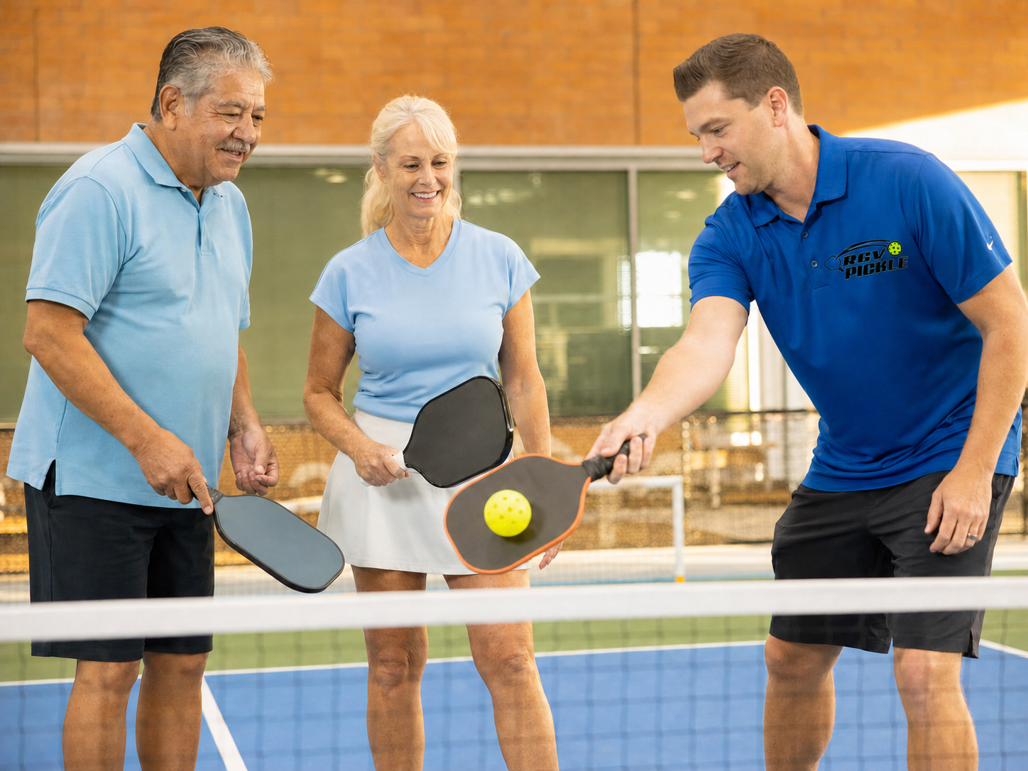 Coach teaching seniors pickleball